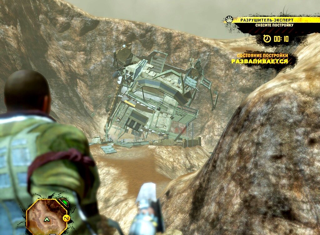 Со скрипом ,подкошенное здание ,падает вниз по откосу.