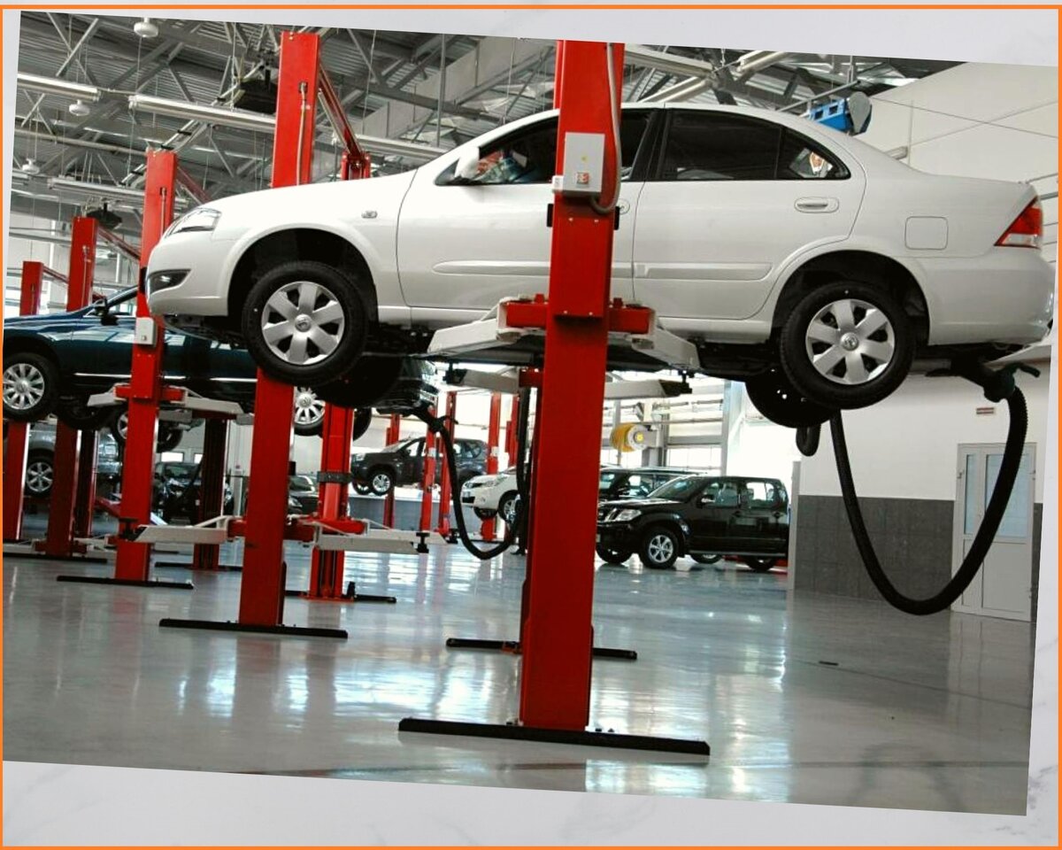 Автомобиль на подъемнике для осмотра рулевой и тормозной систем