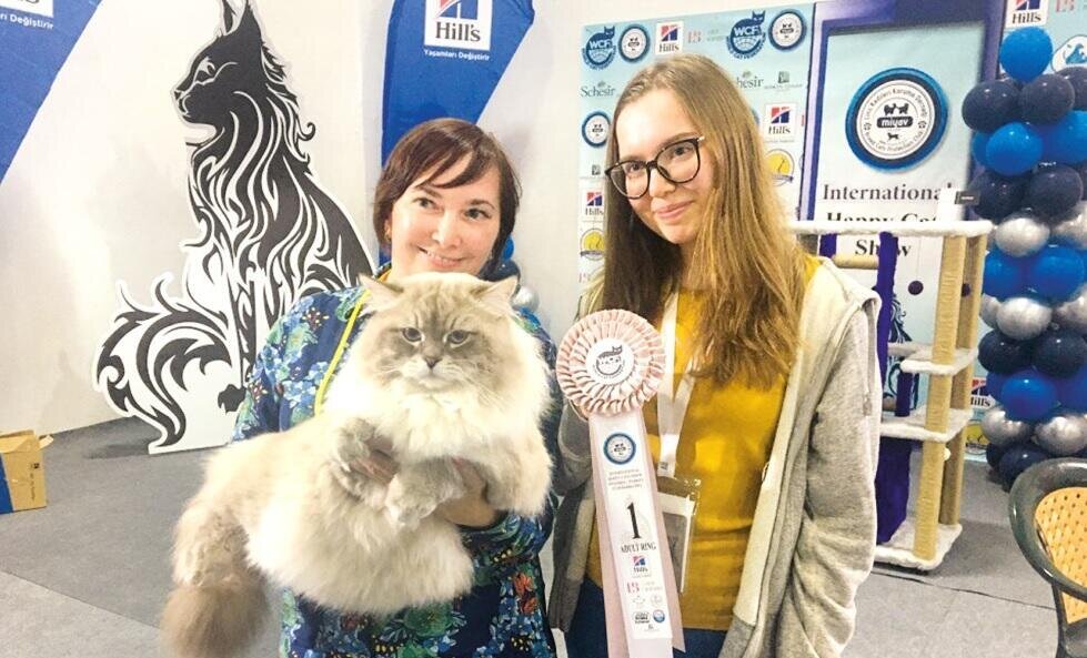 Lova, the winner of the contest, poses with her owner (L), in Istanbul, Turkey, Oct. 24, 2021. (IHA Photo)