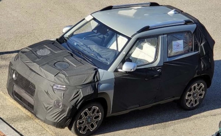 Жаль в камуфляже, интересно было бы глянуть на машину без закрывающей материи