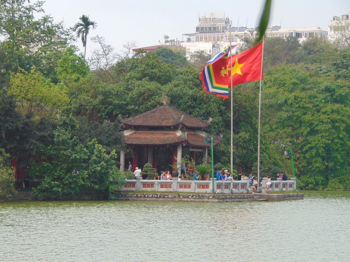 Fig. 3. Vietnam, Hanoi, Hoan Kiem Lake-Returned sword, Ngoc Son Temple with red flags.