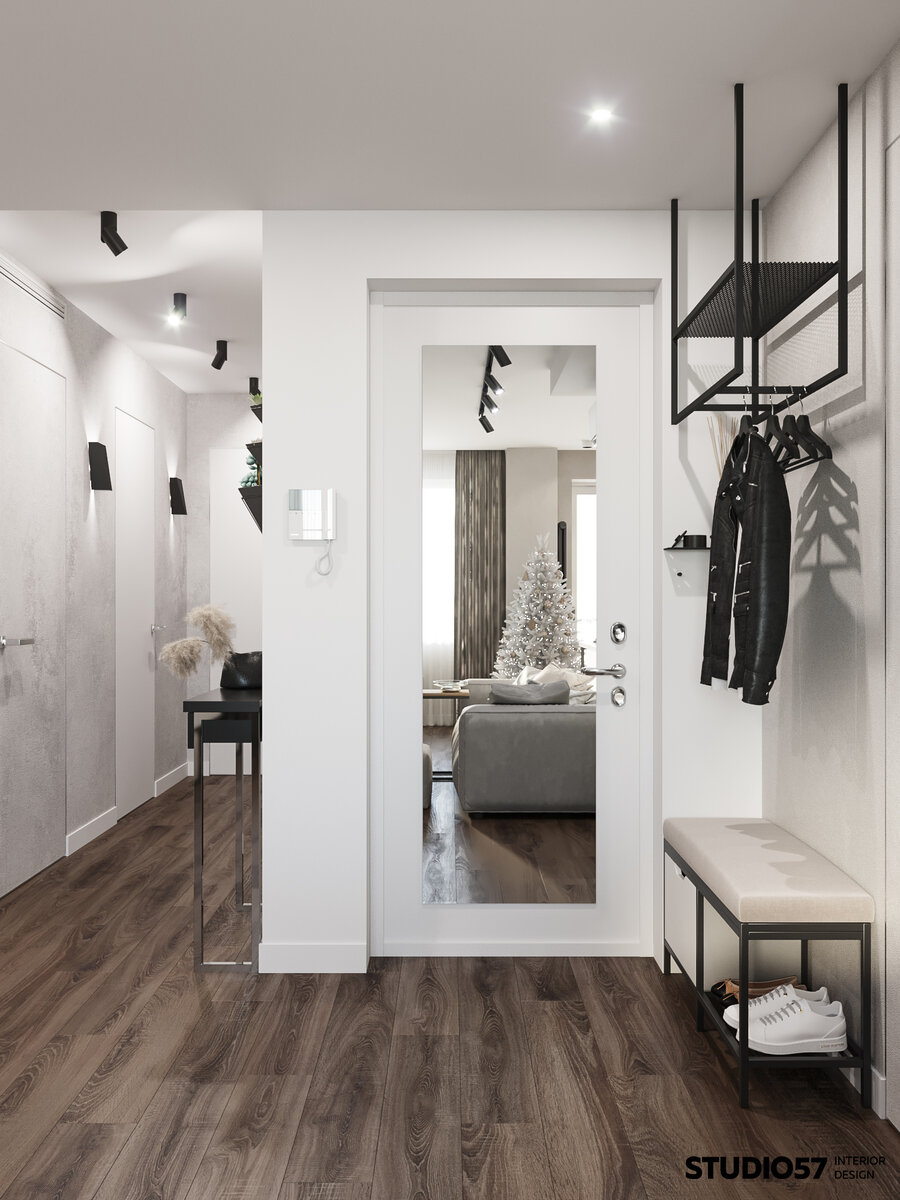 В открытом пространстве нужно было организовать место для верхней одежды. Вместо шкафа была предусмотрена подвесная металлическая конструкция с сетчатой полкой для аксессуаров. Впритык по размерам смог встать небольшой пуф с обувницей и закрытым ящиком.