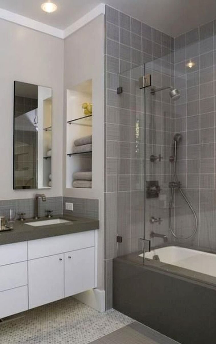 Навесной шкаф в интерьере современной ванной.