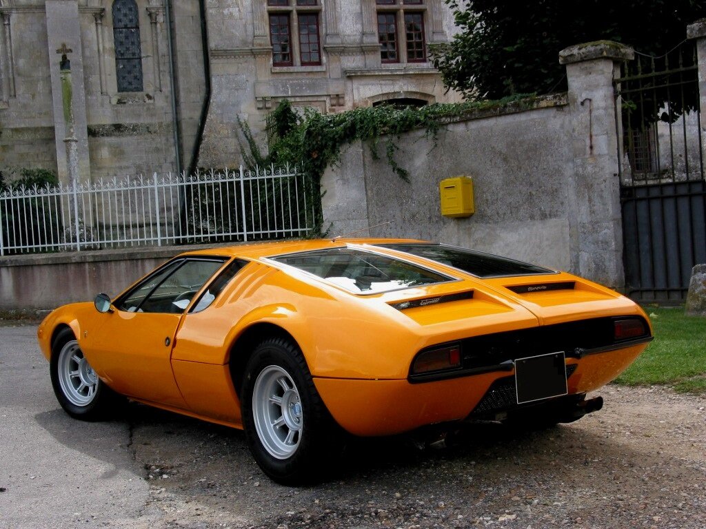 Автомобили 70. Автомобиль de Tomaso Mangusta. Автомобили de Tomaso Mangusta 1967 года. Lamborghini de Tomaso. De Tomaso Mangusta 1971.