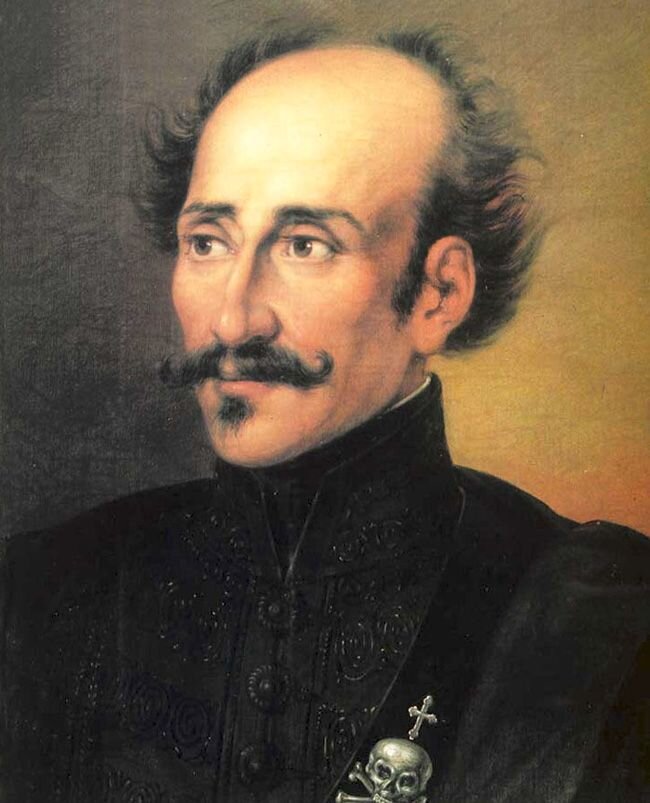 Любопытная штучка у Ипсиланти  на левой груди - у сердца. Смерть захватчикам!