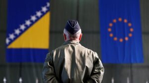    A member of European Forces (EUFOR) stands in front of the Bosnia and Herzegovina and European Union flags during Change of Command Ceremony in Sarajevo, Bosnia and Herzegovina March 28, 2017. REUTERS/Dado Ruvic - RC1846176500 Даниил Кугушев