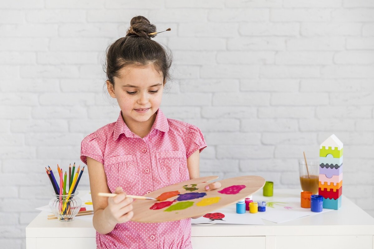 A child holding a Counter. A child holding a Bookmark.