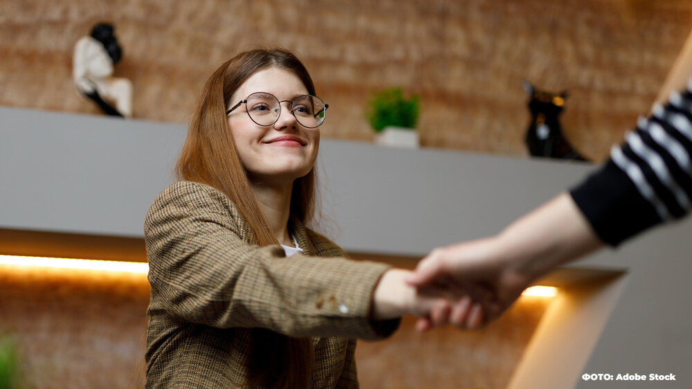    Business handshake of young woman, successful deal. Young smiling trainee girl is being interviewed for a new job. Игорь Умаров