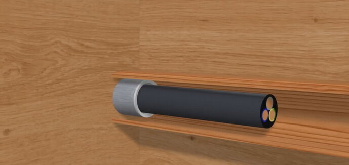 Проход кабеля сквозь стену через гильзу 