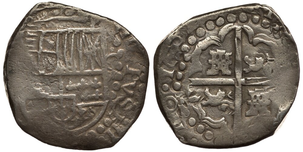 Испанские 8 реалов начала XVII века. Трудно сказать по этой монете талерового типа, где конкретно и в каком году она отчеканена (легенда на подобном "обрубке" едва читается)