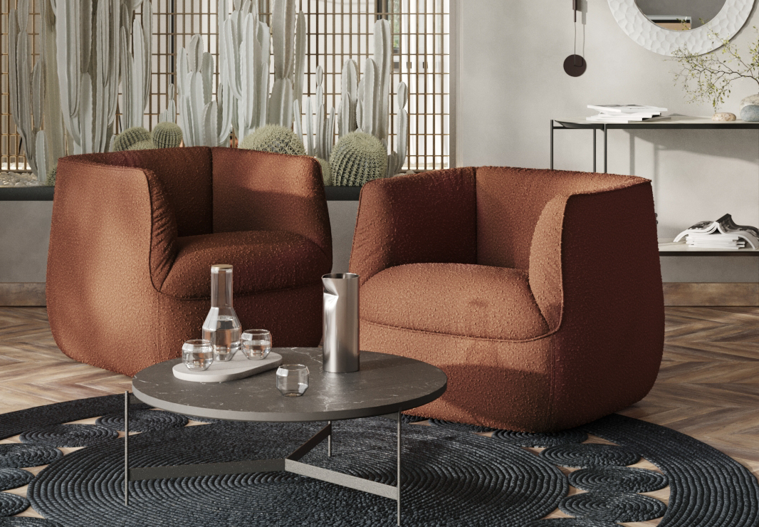 Воздушные кресла с обивкой из ткани букле придают гостиной легкость и очарование