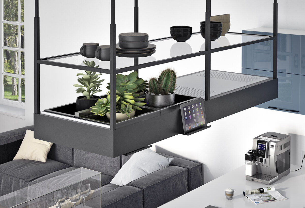 На фото: «Стильные Кухни». Подвесные полки в зоне кухонного острова очень удобны, на них можно закрепить планшет с рецептом или референсом блюда, которое собираетесь приготовить. 