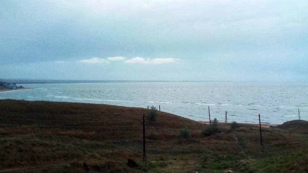 А это вид с нашего балкона на Азовское море и залив