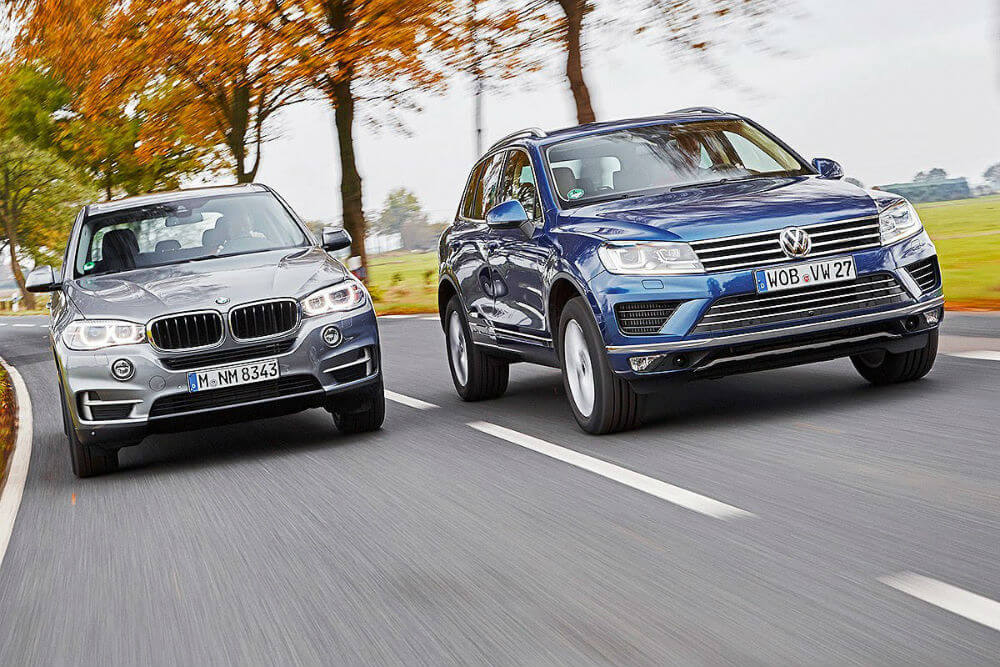 Bmw volkswagen. Туарег и БМВ х5. X5 vs Touareg. БМВ х6 и Фольксваген Туарег. БМВ x5 и Туарег.