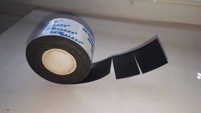 Достаточно зафиксировать 2 ножки, машинка уже станет тише отжимать и перестанет скакать. 
Я наклеил скотч на 4 ножки и не узнал свою. Она стала практически бесшумная*

*(в сравнении с тем как шумела раньше)