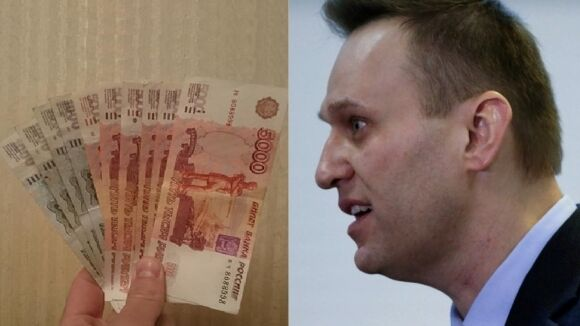 Скандальный блогер Навальный смотрит на деньги. Фото с сайта riafan.ru