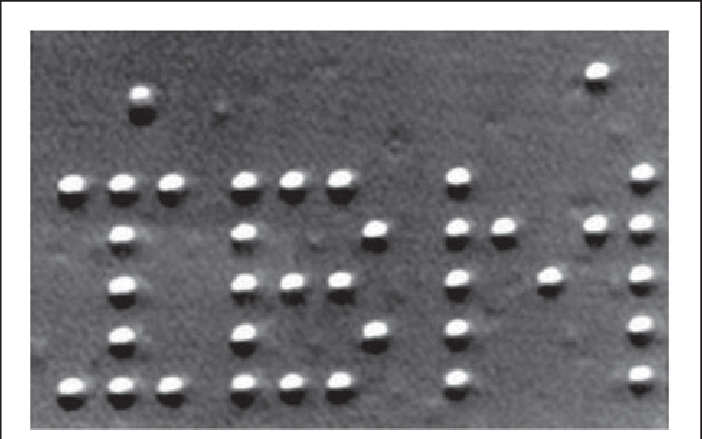 Логотип IBM из атомов ксенона, созданный учёными в 1990 году при помощи сканирующего туннельного микроскопа