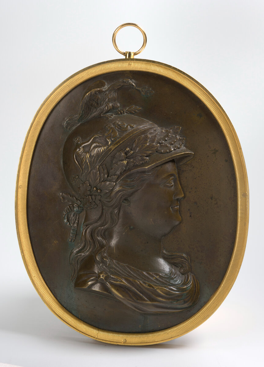 Жан-Доменик Рашетт (Rachette) (1744-1809)  . Медальон с портретом Екатерины II в образе Миневры  . Модель около 1783, отливка 1801-1804.     Бронза, литье, чеканка, патинирование  .     Представляет Галерея «Византия», Санкт-Петербург