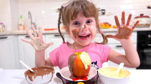 Eva and mom plays with a chocolate