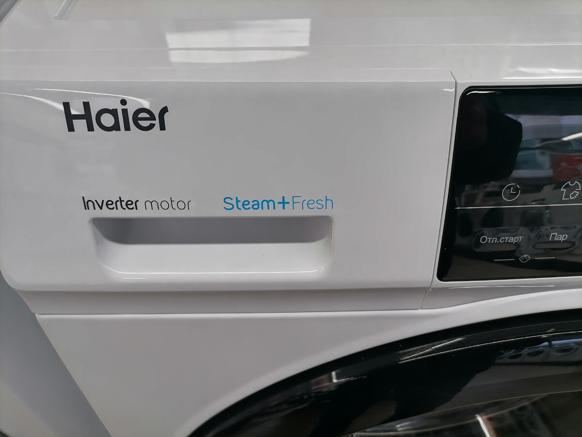 Стиральная машина Haier наличие инверторного мотора и спецпрограмм с паром указывается на панели управления 