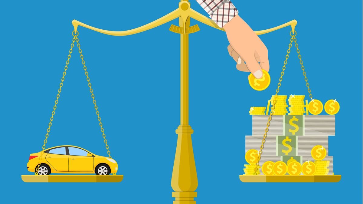    Автомобиль и деньги на весах© Fotolia / Rogatnev