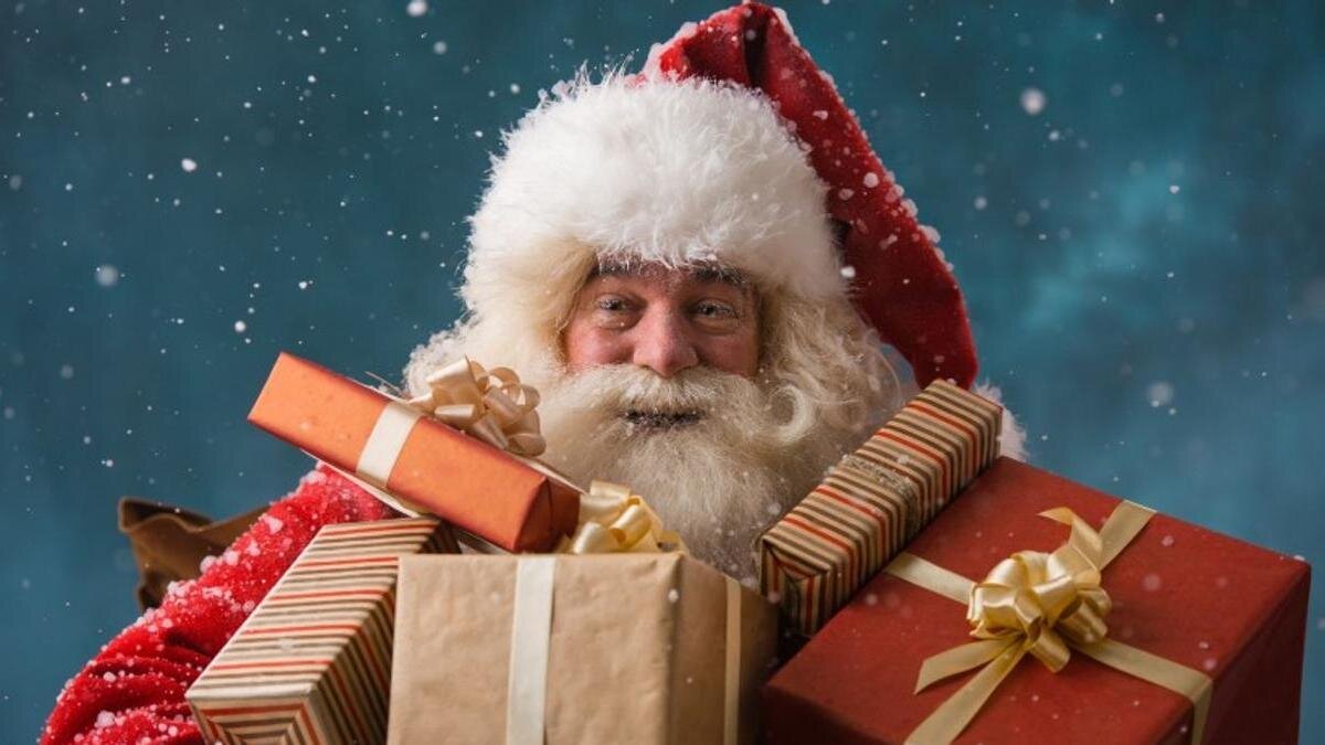    Дед Мороз держит в руках подарки:Pixabay