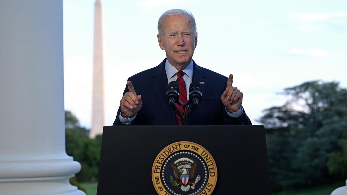    Джо Байден за трибуной:Jim Watson-Pool / Getty Images