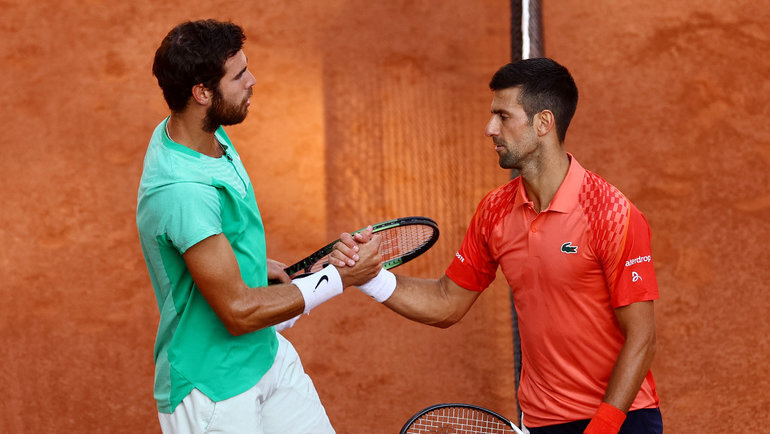    Карен Хачанов и Новак Джокович. Reuters