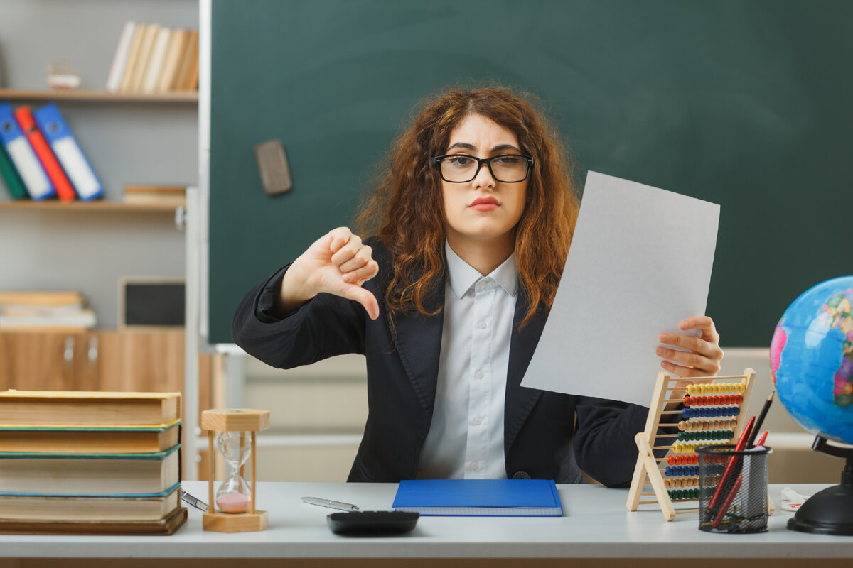<a href="https://www.freepik.com/free-photo/sad-showing-thumbs-down-young-female-teacher-wearing-glasses-holding-paper-sitting-desk-with-school-tools-classroom_28148086.htm#query=%D1%81%D0%B2%D0%BE%D0%B1%D0%BE%D0%B4%D0%B0%20%D1%83%D1%87%D0%B8%D1%82%D0%B5%D0%BB%D1%8C%D0%BD%D0%B8%D1%86%D1%8B&position=44&from_view=search&track=ais">Image by stockking</a> on Freepik