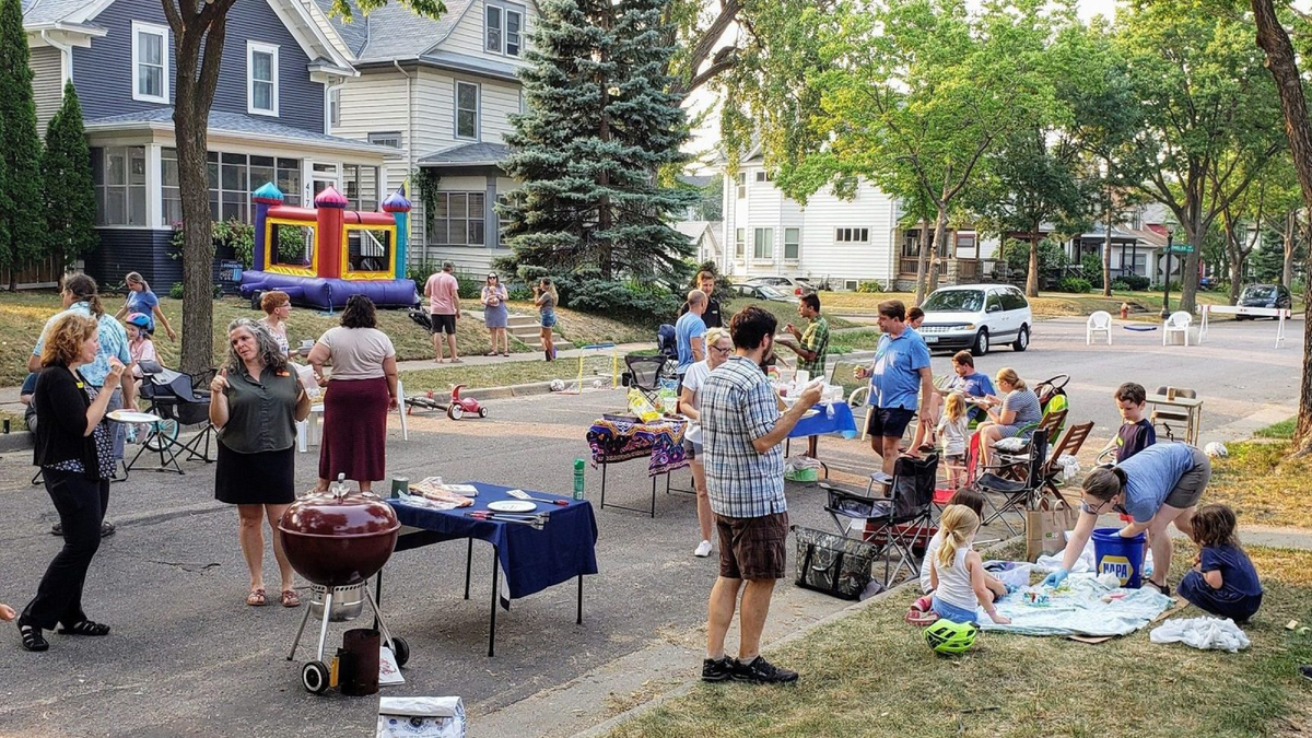 Block party - a party that is held outdoors in a street or other public place, often organized by the people living in the local area.