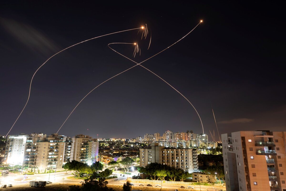    Streaks of light are seen as Israel's Iron Dome anti-missile system intercept rockets launched from the Gaza Strip towards Israel, as seen from Ashkelon, Israel May 13, 2021. REUTERS/Amir Cohen editor
