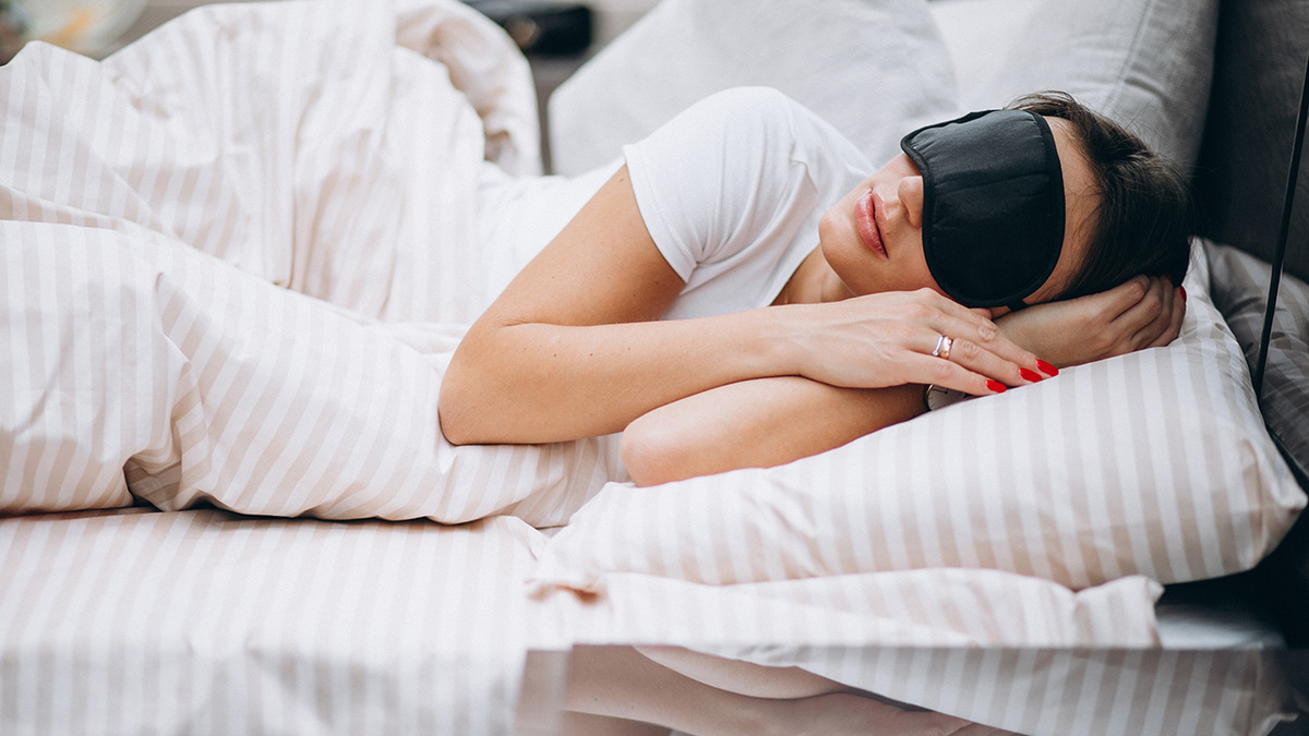    Young woman resting in bed in the morning