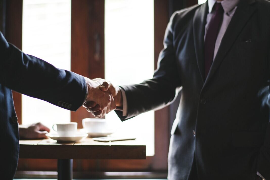    Business people shaking hands in a meeting room