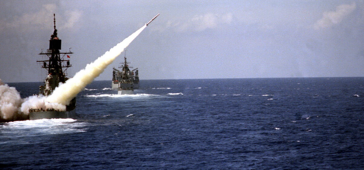    An RIM-2 Terrier surface-to-air missile is fired from the guided-missile destroyer USS FARRAGUT (DDG-37). The destroyer USS CARON (DD-970) and the fast combat support ship USS DETROIT (AOE-4) are underway ahead of the FARRAGUT. grom