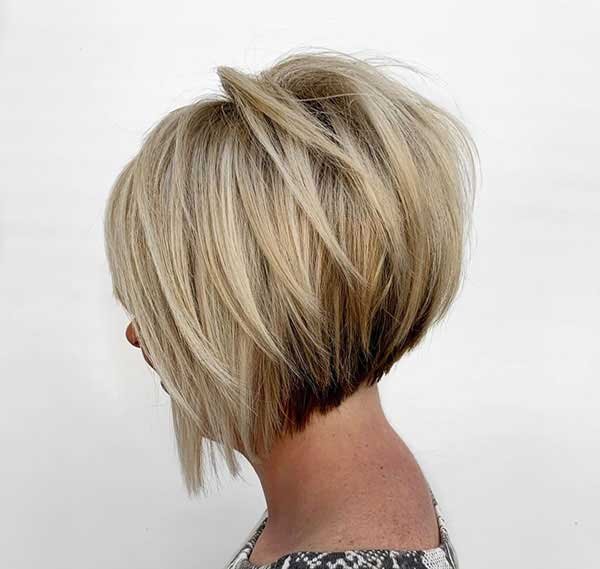 The transition from dark to blonde gets the praise it deserves with an inverted bob cut. by adding piece-y angled layers on top of stacked layers, you get some extra height and flattering movement.
