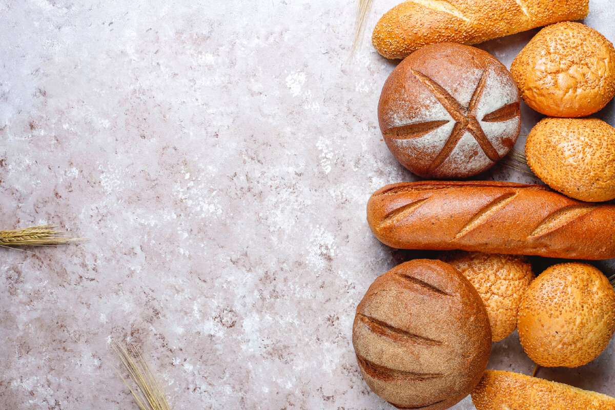 <a href="https://www.freepik.com/free-photo/different-kinds-fresh-bread-as-background-top-view_7999563.htm#query=bakery&from_query=%D0%B2%D1%8B%D0%BF%D0%B5%D1%87%D0%BA%D0%B0&position=2&from_view=search">Image by azerbaijan_stockers</a> on Freepik