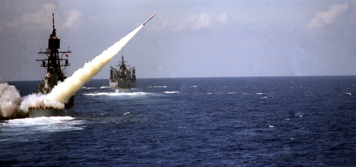    An RIM-2 Terrier surface-to-air missile is fired from the guided-missile destroyer USS FARRAGUT (DDG-37). The destroyer USS CARON (DD-970) and the fast combat support ship USS DETROIT (AOE-4) are underway ahead of the FARRAGUT. editor