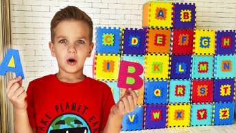 Mark looks for letters and opens boxes with surprises to learn the alphabet