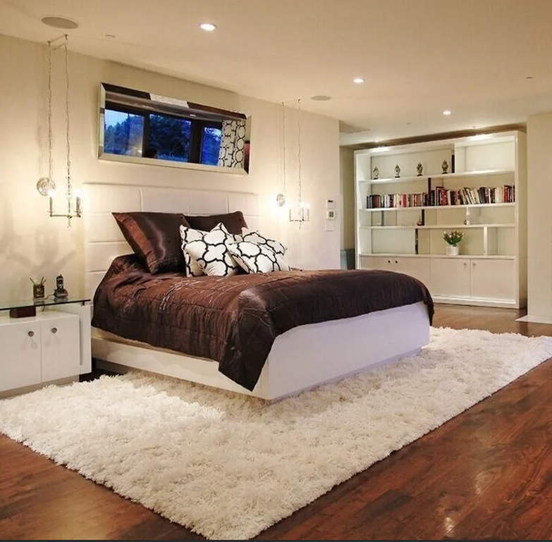 Ковер по кроватью в интерьере Layered Rug Ideas to Transform Your Space Overstock.com Bedroom rug placement, L