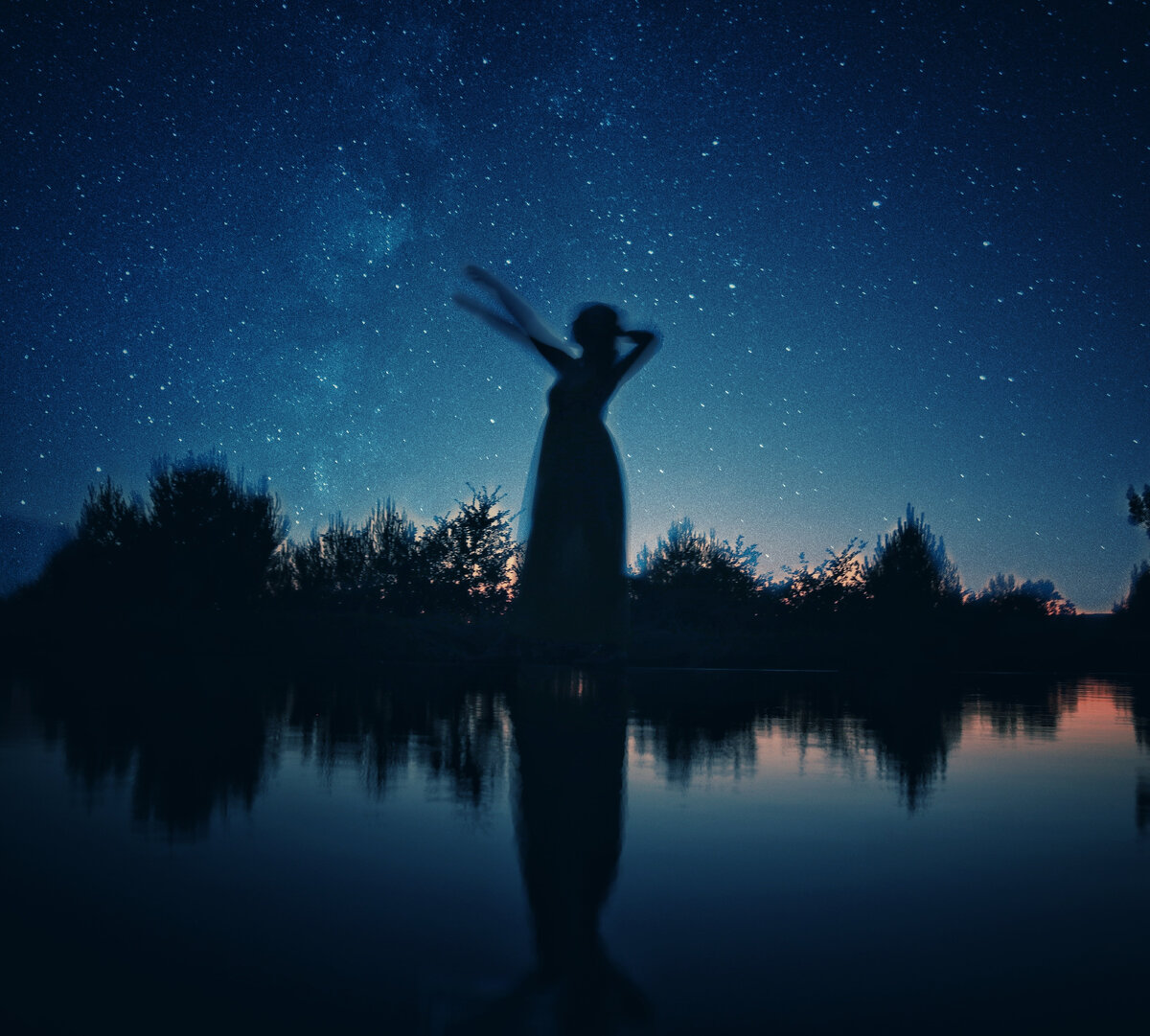 Photo by Baraa Jalahej: https://www.pexels.com/photo/silhouette-of-woman-standing-on-rock-near-body-of-water-during-night-time-3751387/ 