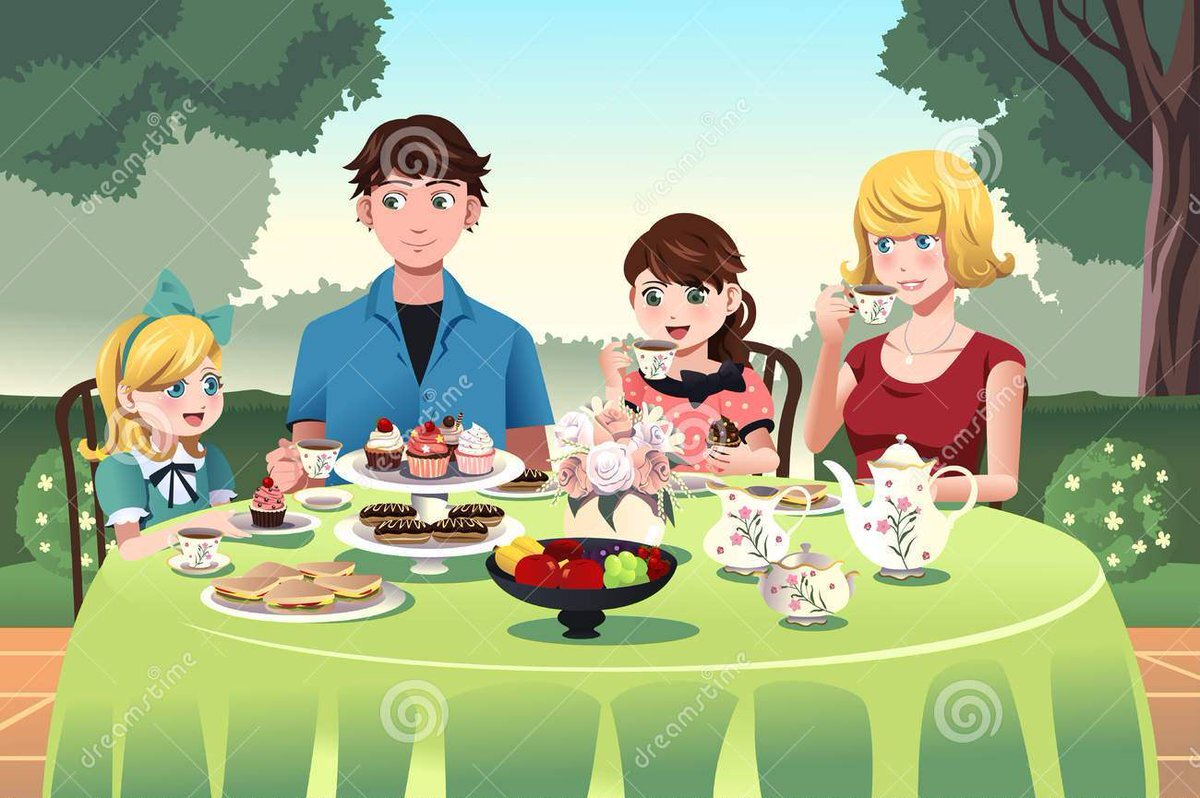 Семья пьет чай за столом