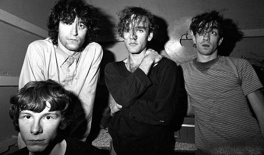 Классический состав R.E.M. на раннем этапе своего существования: Майк Миллз, Питер Бак, Майкл Стайп, Билл Берри.