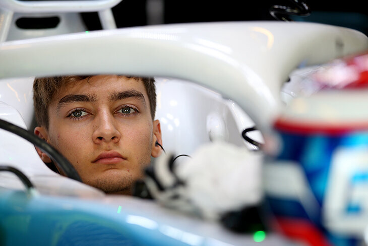 F1 Drivers sit in car