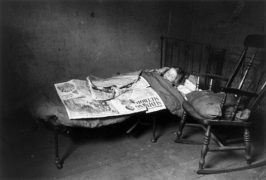 1956. A child sleeps in a Liverpool slum. 88,000 of these homes were considered uninhabitable.