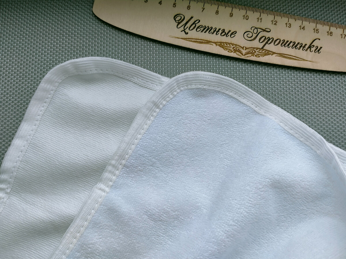 с одной стороны слой мягкий, с другой похож на клеёнку