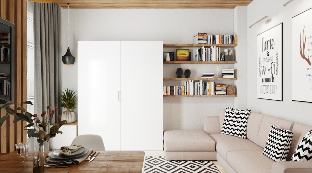 Гостиная с книжными полками, имитирующая зону библиотеки. Здесь также расположен удобный угловой диван.