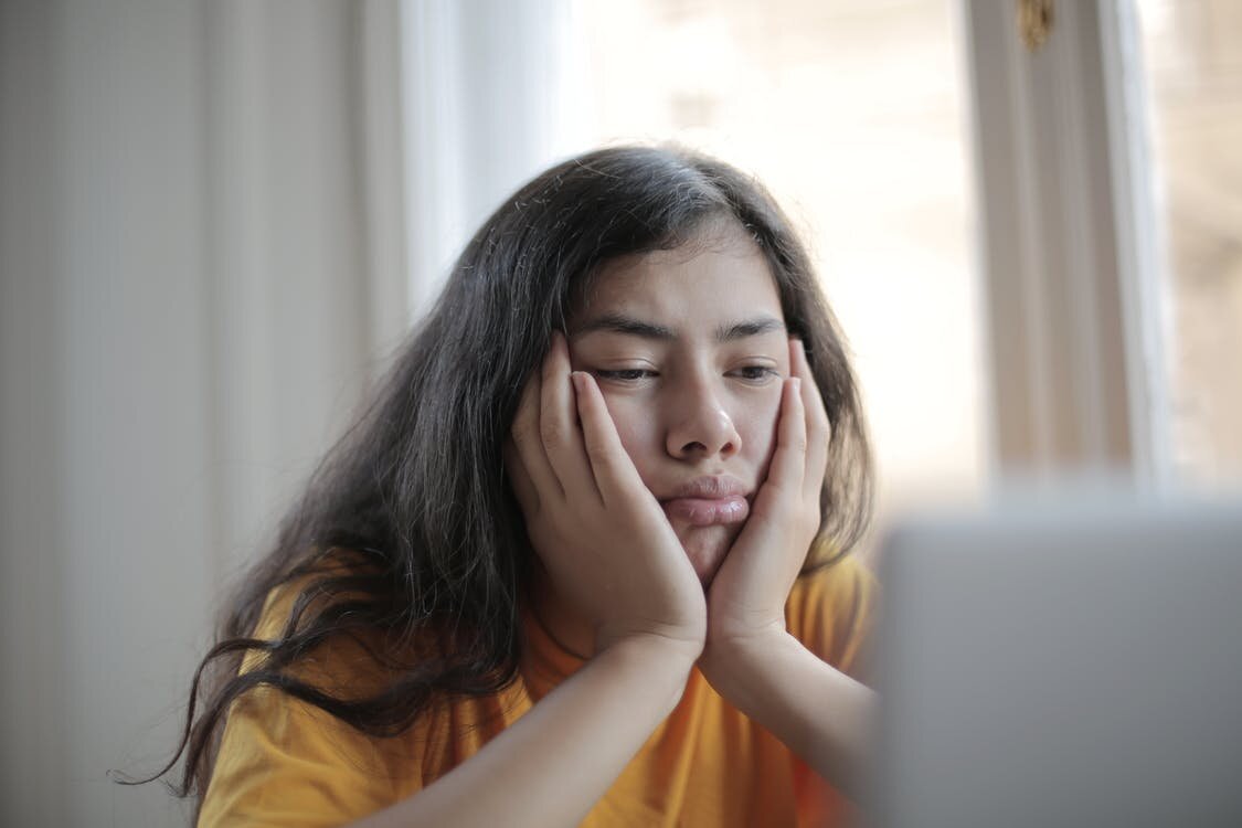 https://www.pexels.com/photo/melancholic-woman-watching-video-on-laptop-at-home-3808012/