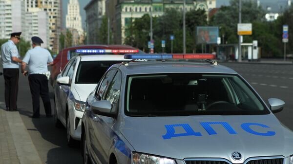    Автомобили полиции на проспекте Мира в Москве© РИА Новости / Мария Девахина