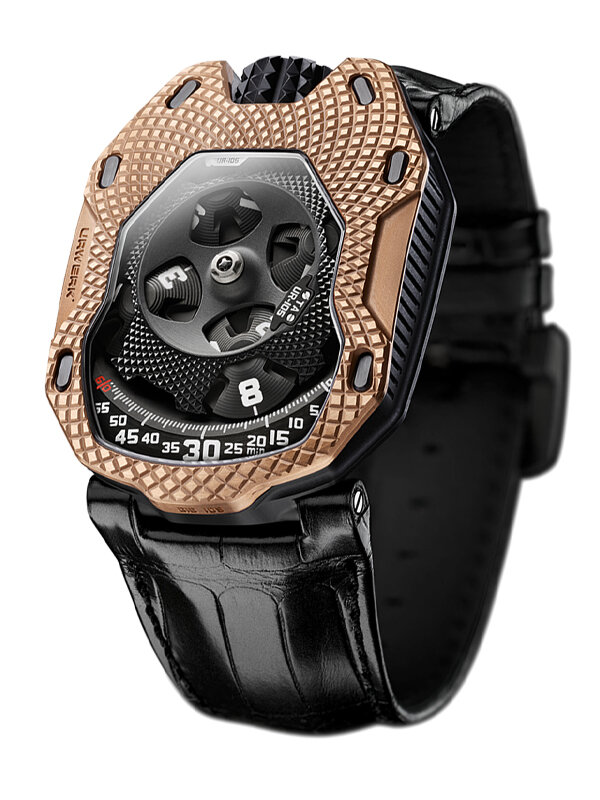 Часы Urwerk UR-105 TA Raging Gold в корпусе из титана и розового золота Индикация времени на четырёх дисках, находящихся на концах вращающегося креста. Диск с текущим часом указывает на минуты
