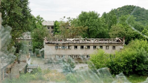    Последствия обстрела в Донецке© РИА Новости / Сергей Аверин